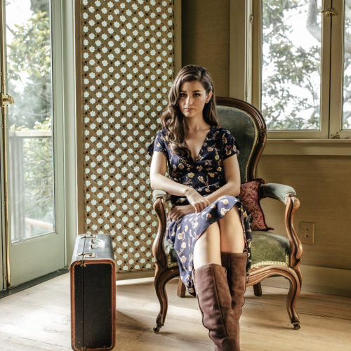 Teryn Grey sitting in chair featured image